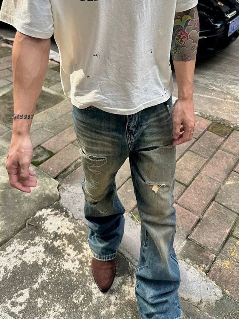 Man wearing vintage distressed denim jeans on the street