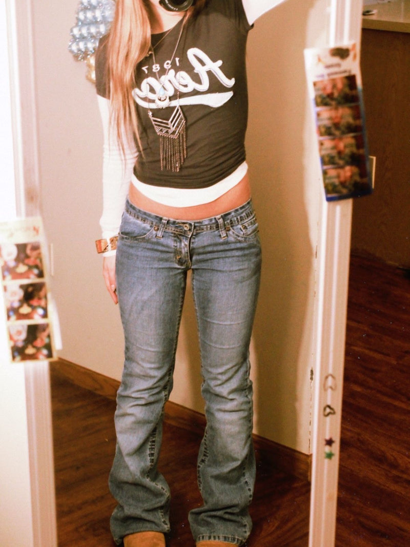 Woman wearing low waist bootcut jeans