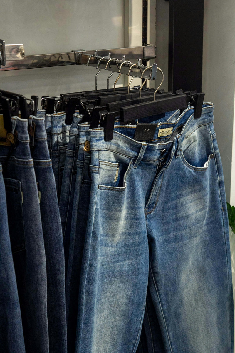 Vintage jeans hanging on a clothes rack