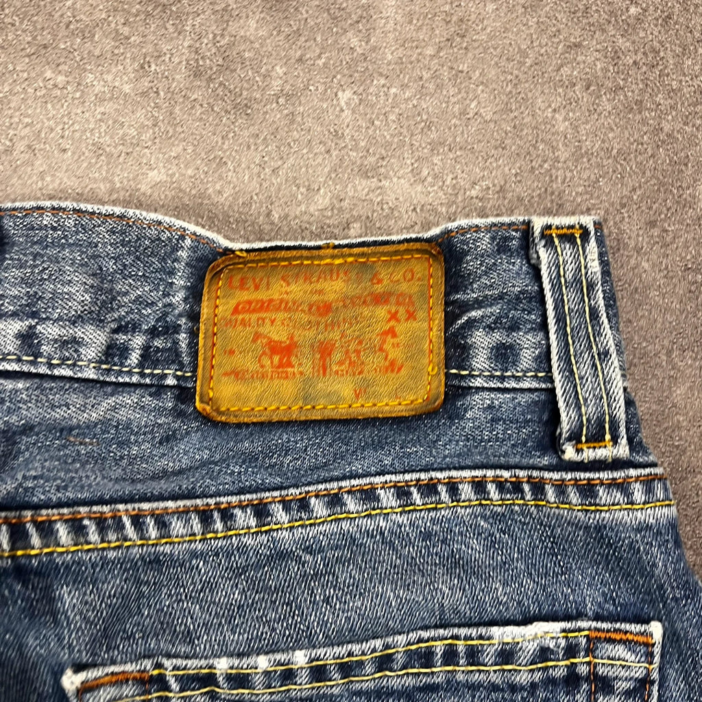 Vintage Levi's 512 Bootcut Custom W29 L28 mit Druckknopf-Leiste und rotem Futter – Ansicht 7